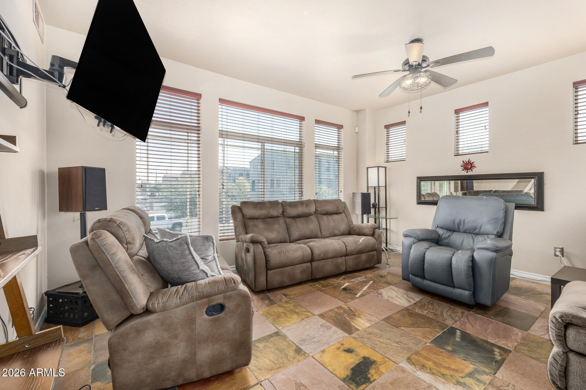 2402 East 5th Street, Unit 1590 Tempe, AZ 85288 - Photo 14 of 33 a living room with furniture ceiling fan and a window