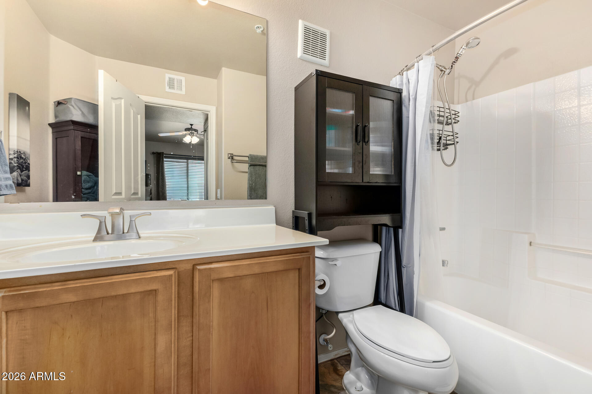 2402 East 5th Street, Unit 1590 Tempe, AZ 85288 - Photo 17 of 33 a bathroom with a granite countertop toilet sink and shower