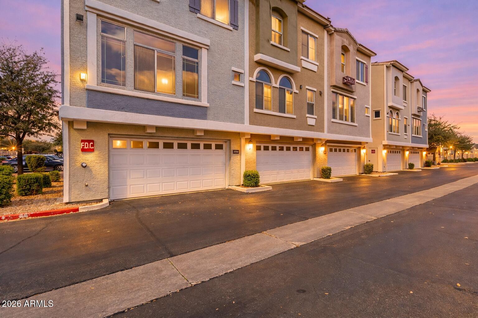 2402 East 5th Street, Unit 1590 Tempe, AZ 85288 - Photo 2 of 33 a front view of a building with street