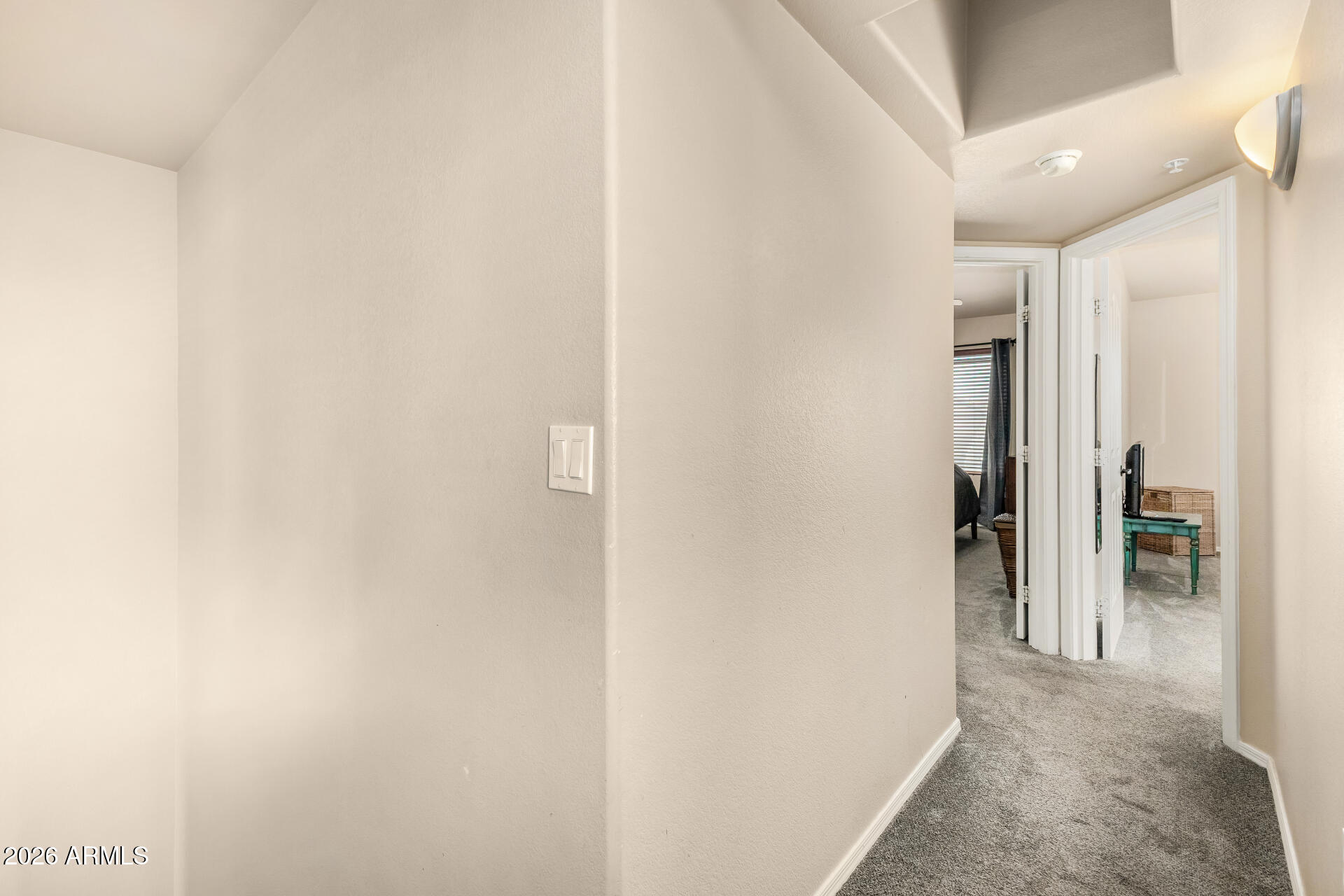 2402 East 5th Street, Unit 1590 Tempe, AZ 85288 - Photo 22 of 33 a view of a hallway with wooden shelves
