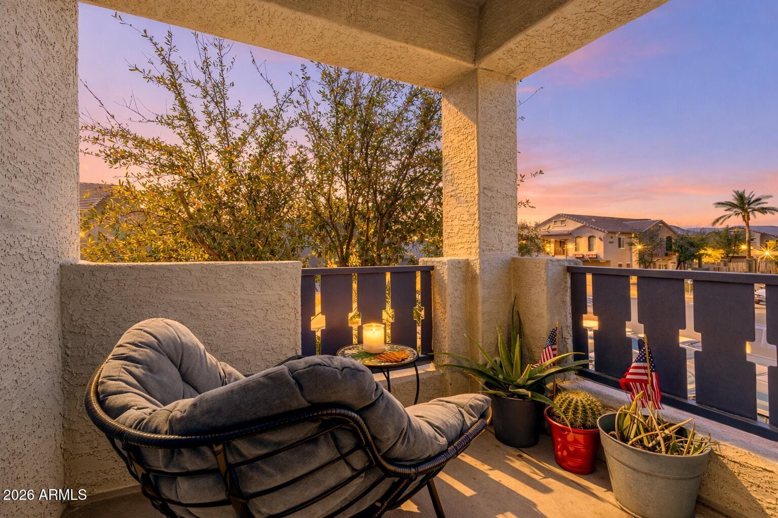 2402 East 5th Street, Unit 1590 Tempe, AZ 85288 - Photo 24 of 33 a view of a balcony with chairs and a potted plant