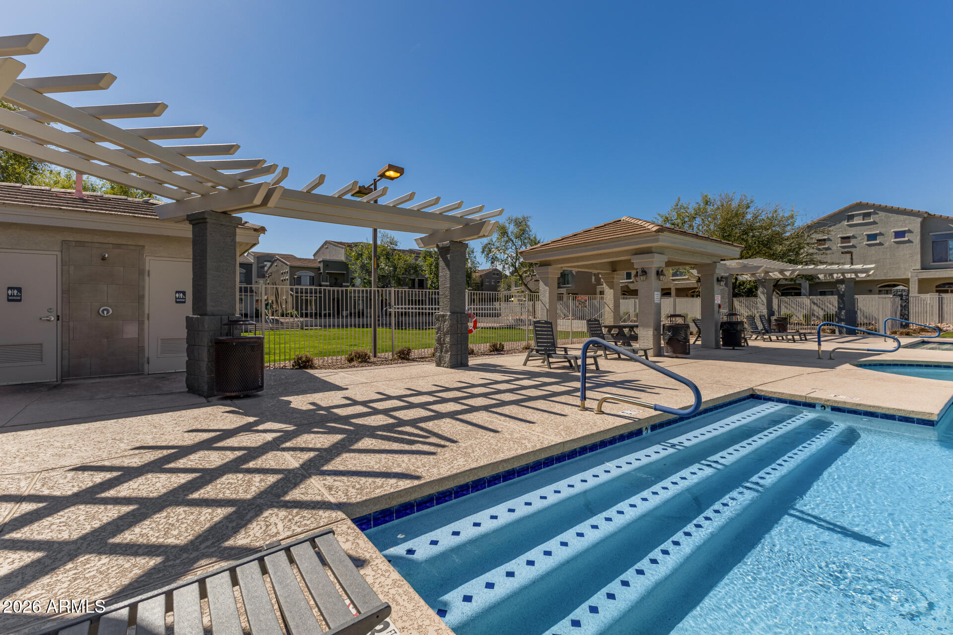 2402 East 5th Street, Unit 1590 Tempe, AZ 85288 - Photo 28 of 33 a view of a patio with swimming pool