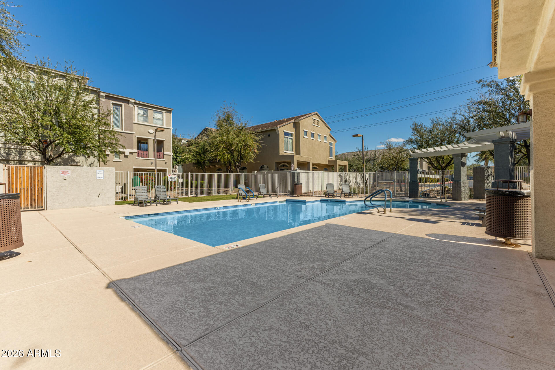 2402 East 5th Street, Unit 1590 Tempe, AZ 85288 - Photo 29 of 33 a view of a building with a swimming pool