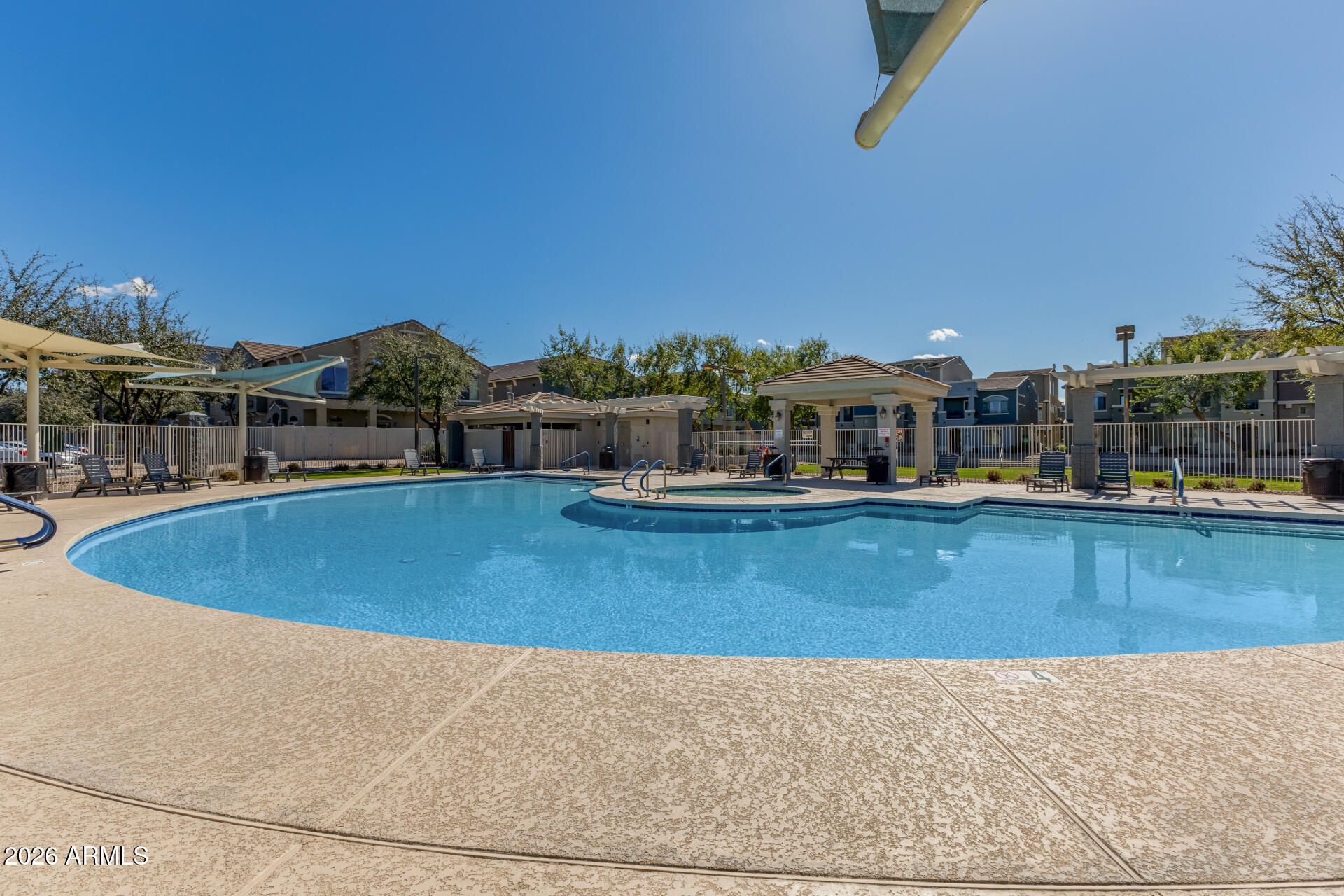 2402 East 5th Street, Unit 1590 Tempe, AZ 85288 - Photo 33 of 33 a view of a swimming pool with a table and chairs
