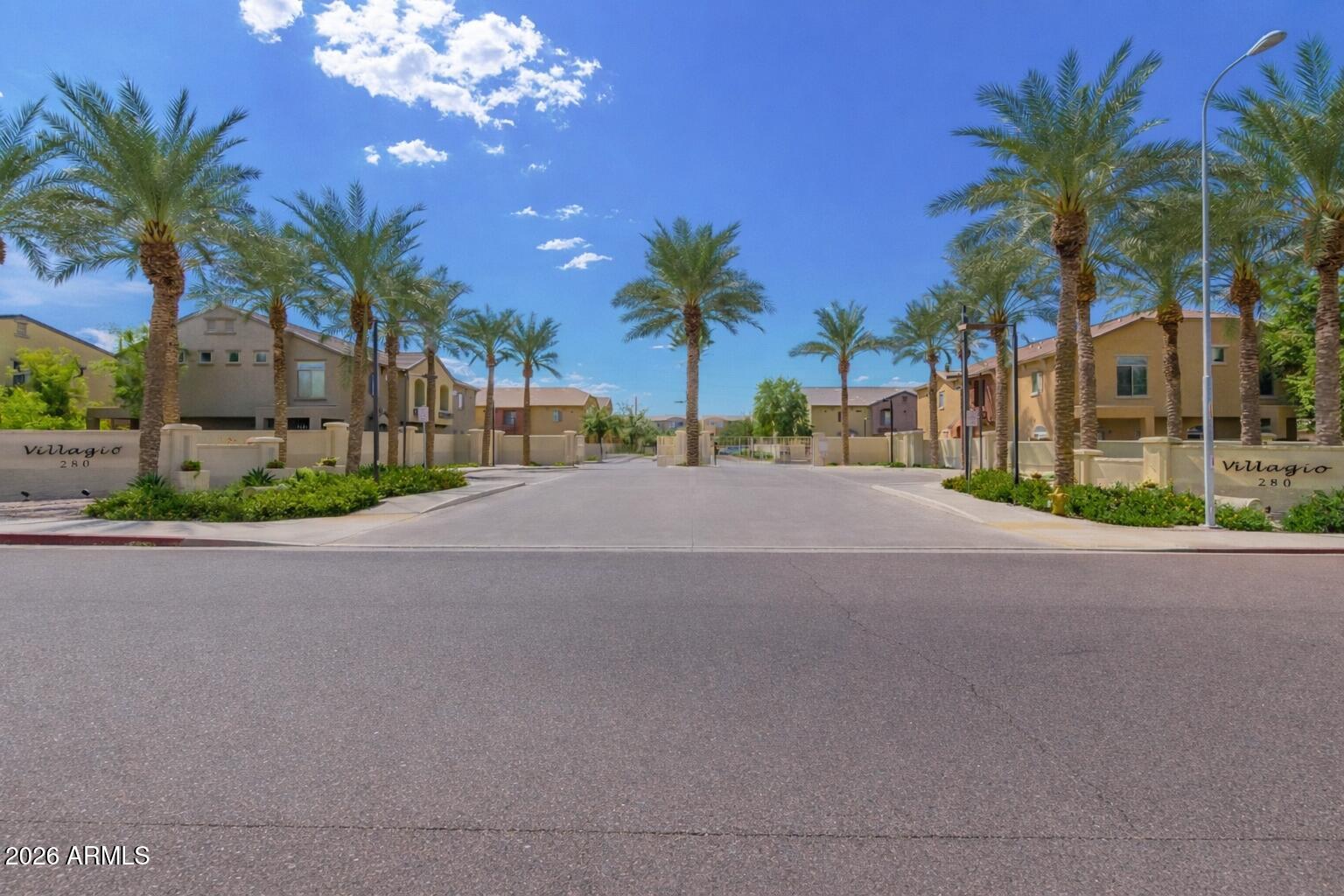 2402 East 5th Street, Unit 1590 Tempe, AZ 85288 - Photo 5 of 33 a view of road and palm trees