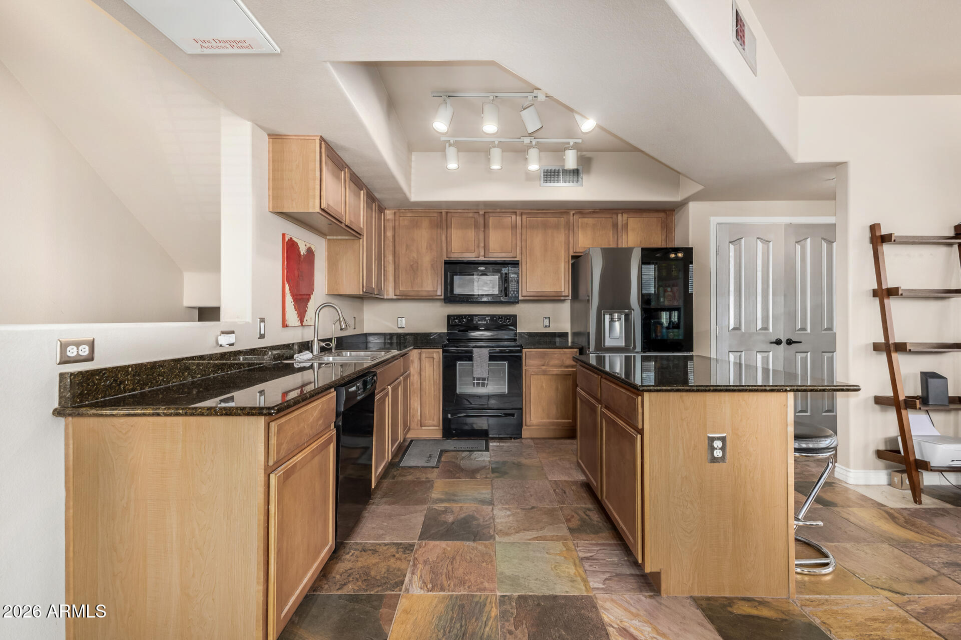 2402 East 5th Street, Unit 1590 Tempe, AZ 85288 - Photo 9 of 33 a large kitchen with stainless steel appliances granite countertop a stove and a sink