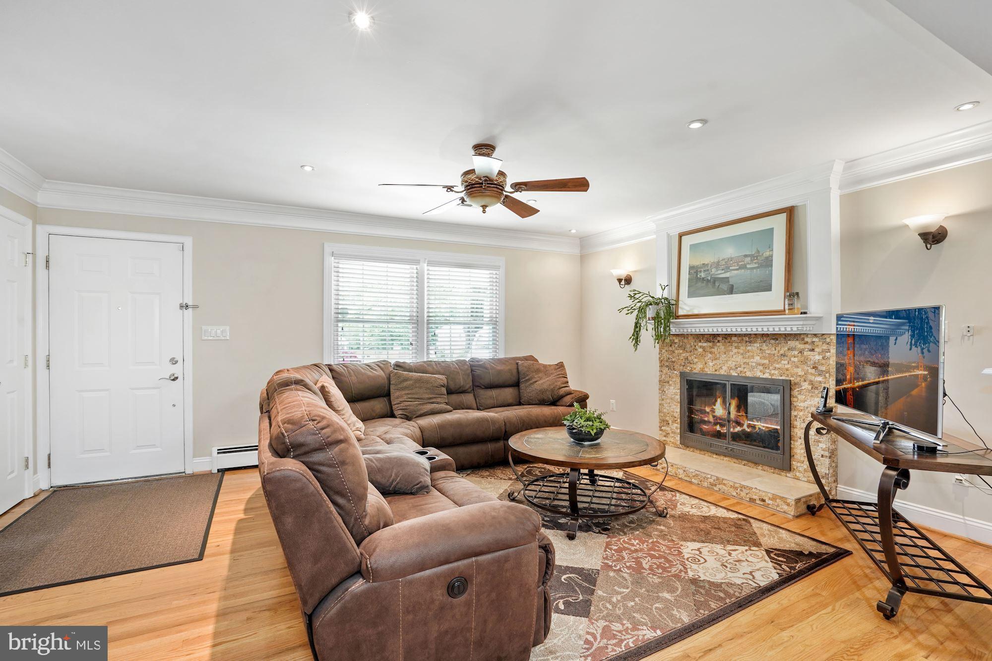 6620 Newington Road Lorton, VA 22079 - Photo 3 of 57 Cozy Two Sided Gas Fireplace with Custom Mantle