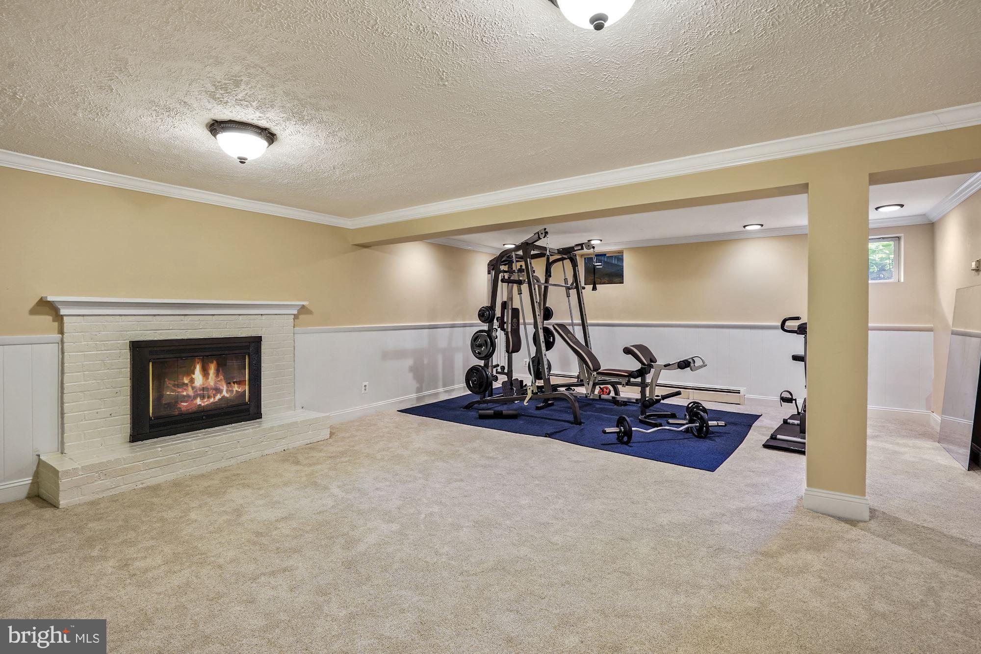 6620 Newington Road Lorton, VA 22079 - Photo 28 of 57 Large Rec Room with Wood Burning Fireplace