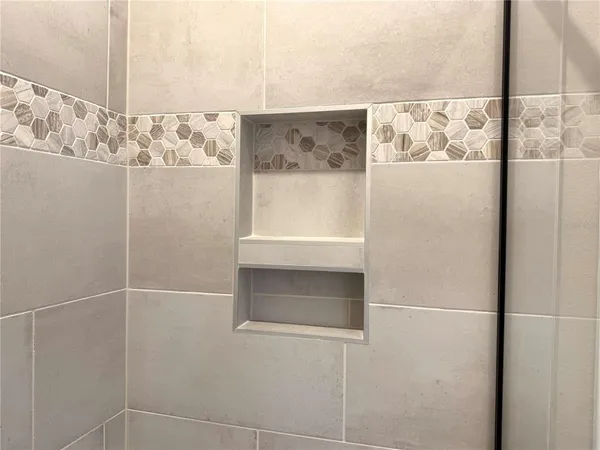 a bathroom with a shower and a sink