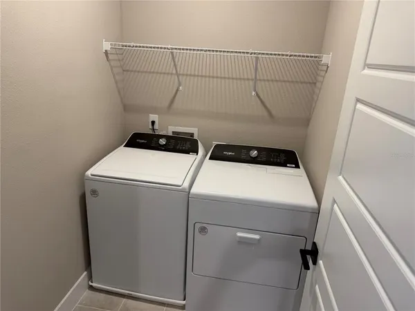 a utility room with dryer and washer