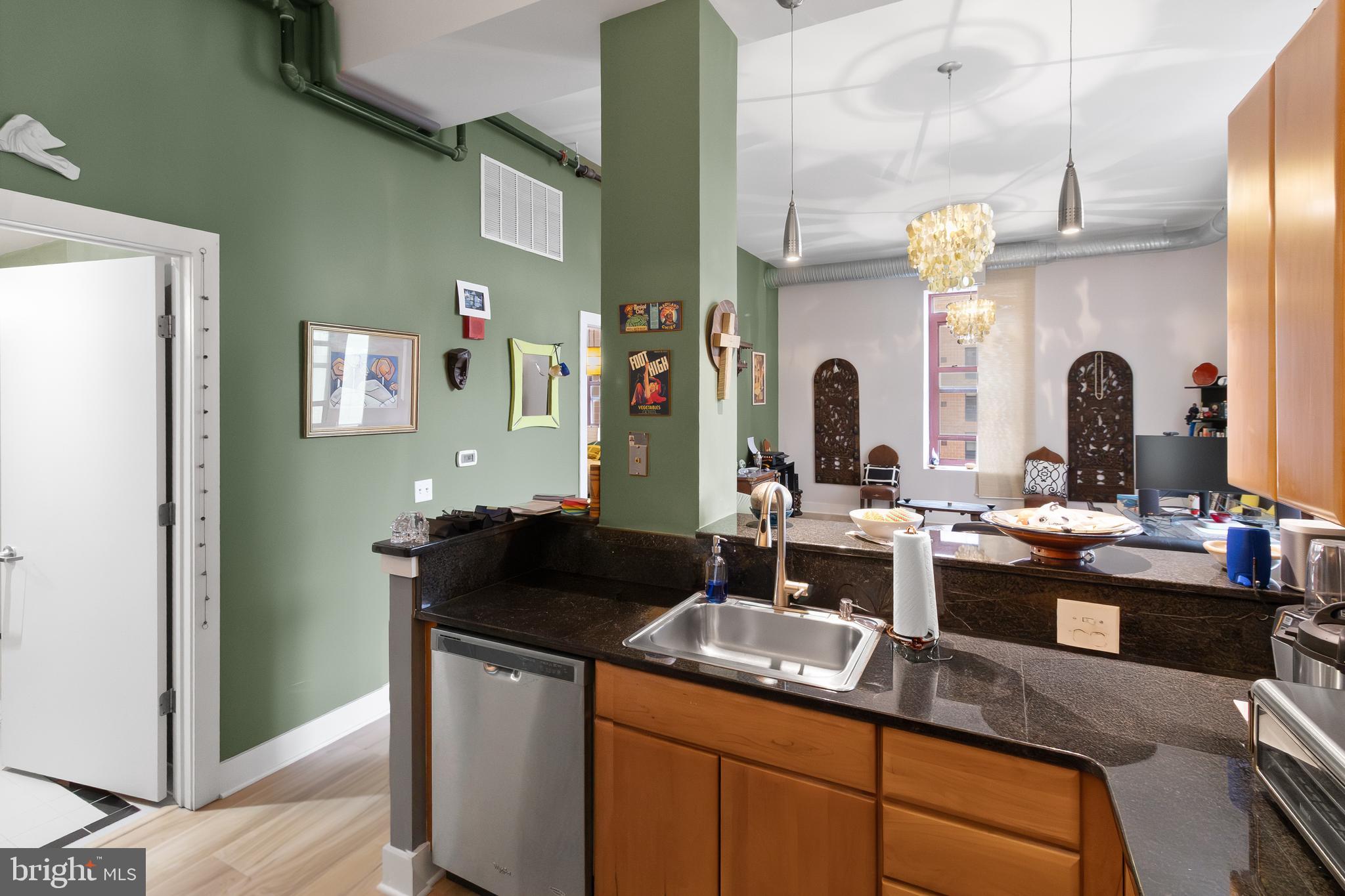 22 South Howard Street, Unit R503 Baltimore, MD 21201 - Photo 12 of 29 a kitchen with a sink stove and refrigerator