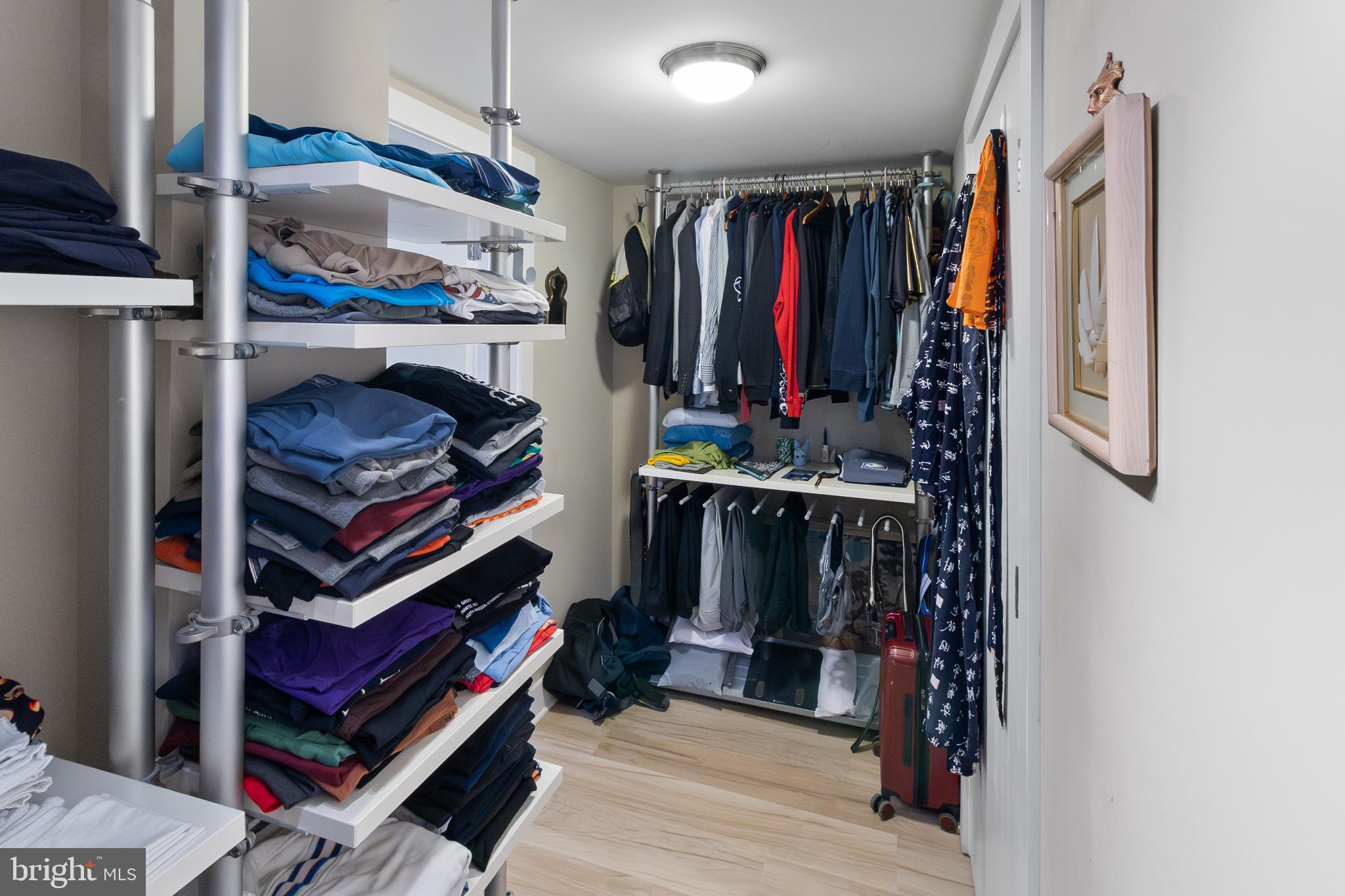 22 South Howard Street, Unit R503 Baltimore, MD 21201 - Photo 16 of 29 a view of walk in closet with clothes and shoes
