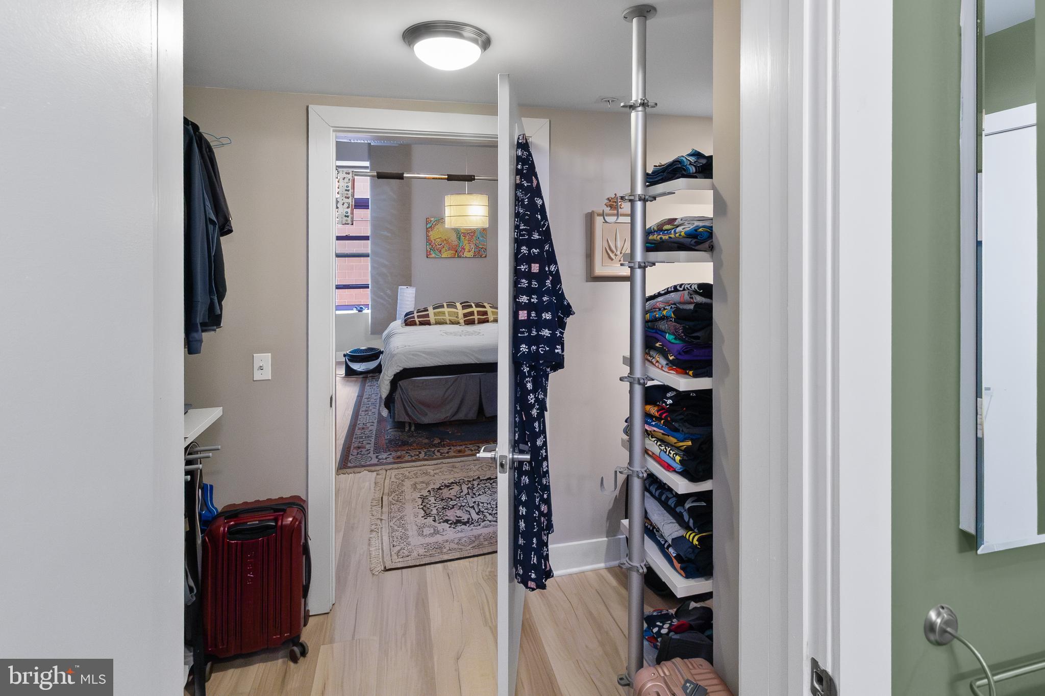 22 South Howard Street, Unit R503 Baltimore, MD 21201 - Photo 17 of 29 a view of walk in closet with clothes and shoes