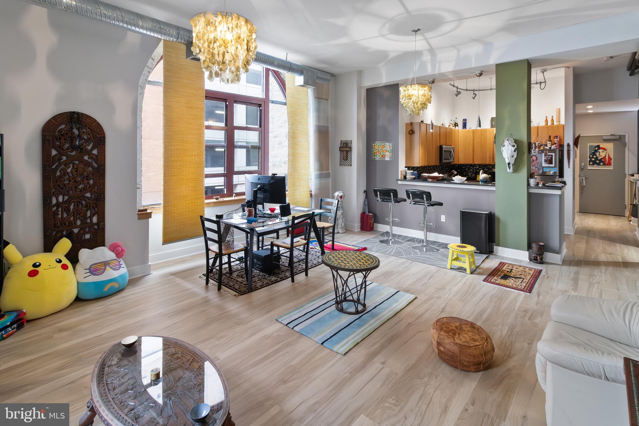 22 South Howard Street, Unit R503 Baltimore, MD 21201 - Photo 3 of 29 a living room with furniture and wooden floor