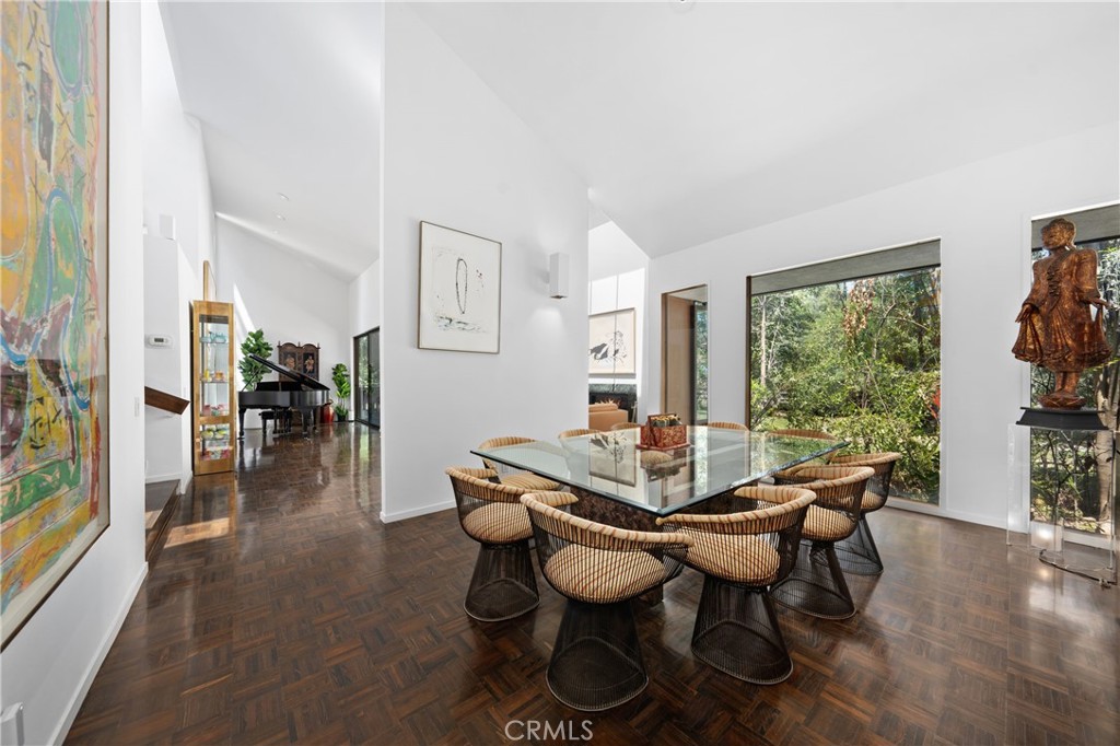 24865 Long Valley Road Hidden Hills, CA 91302 - Photo 16 of 49 a view of a dining room with furniture window and wooden floor