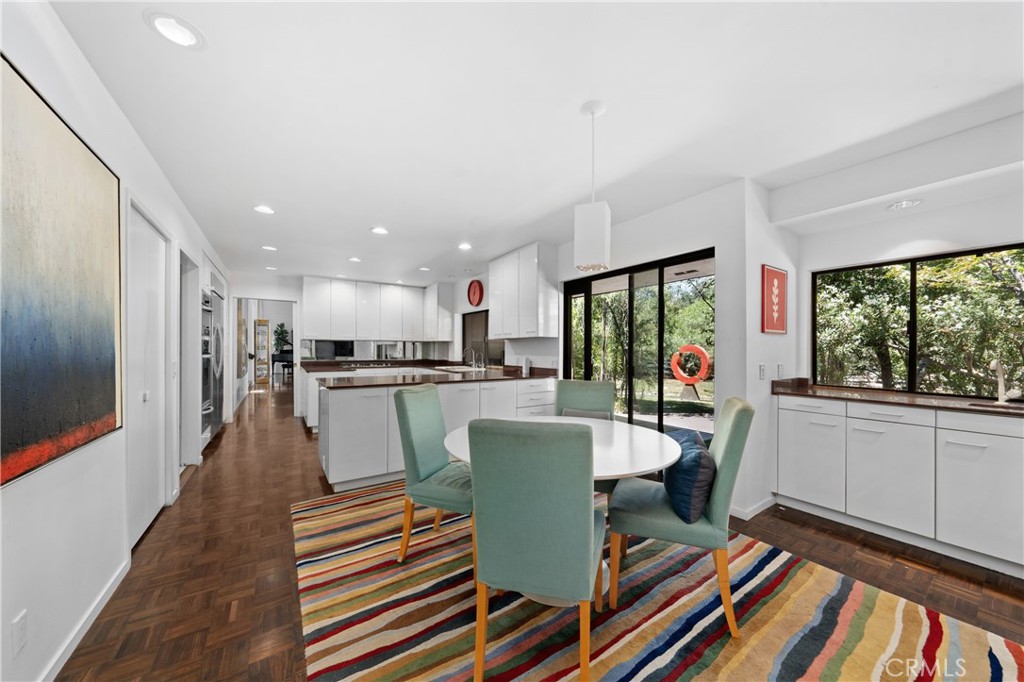 24865 Long Valley Road Hidden Hills, CA 91302 - Photo 22 of 49 a dining room with furniture and a floor to ceiling window