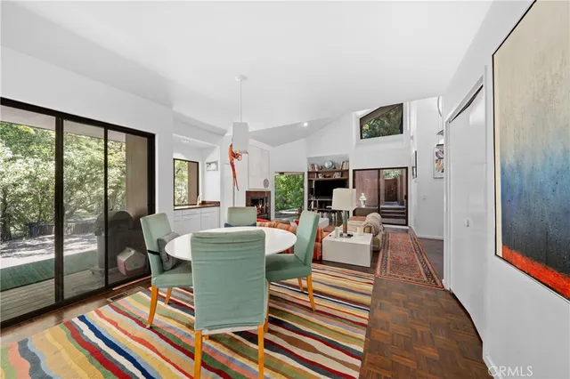 a kitchen with granite countertop white cabinets and stainless steel appliances