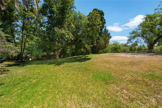 a backyard of a house with lots of green space