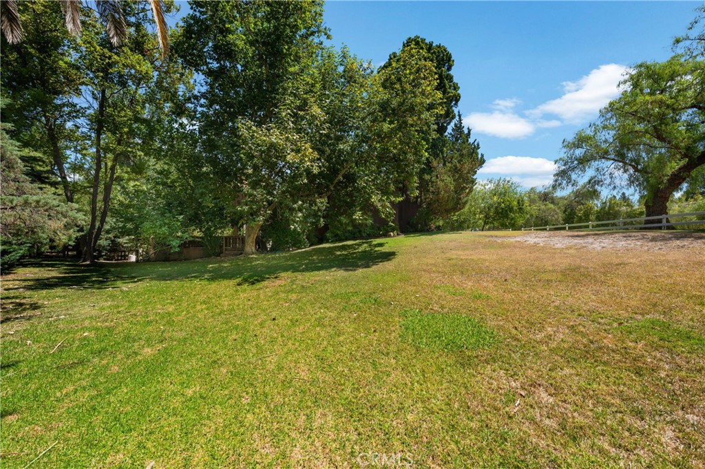 24865 Long Valley Road Hidden Hills, CA 91302 - Photo 27 of 49 a view of a field with trees in background