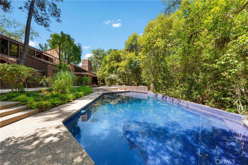 24865 Long Valley Road Hidden Hills, CA 91302 - Photo 33 of 49 a view of a backyard with swimming pool