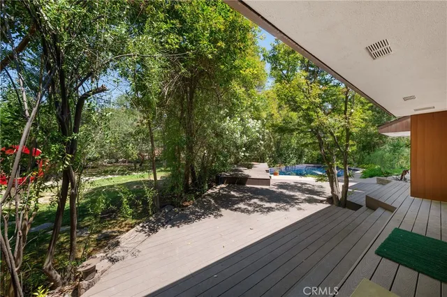a view of a yard with wooden floor
