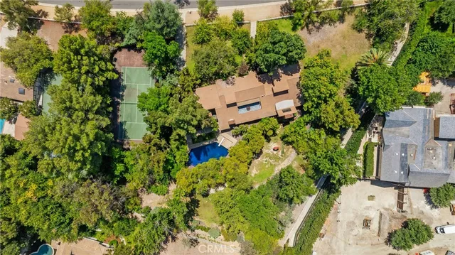 an aerial view of mountain with yard