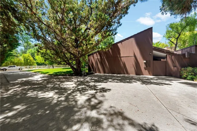 a backyard of a house with lots of green space