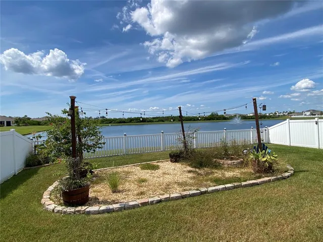 a view of a garden with lawn chairs