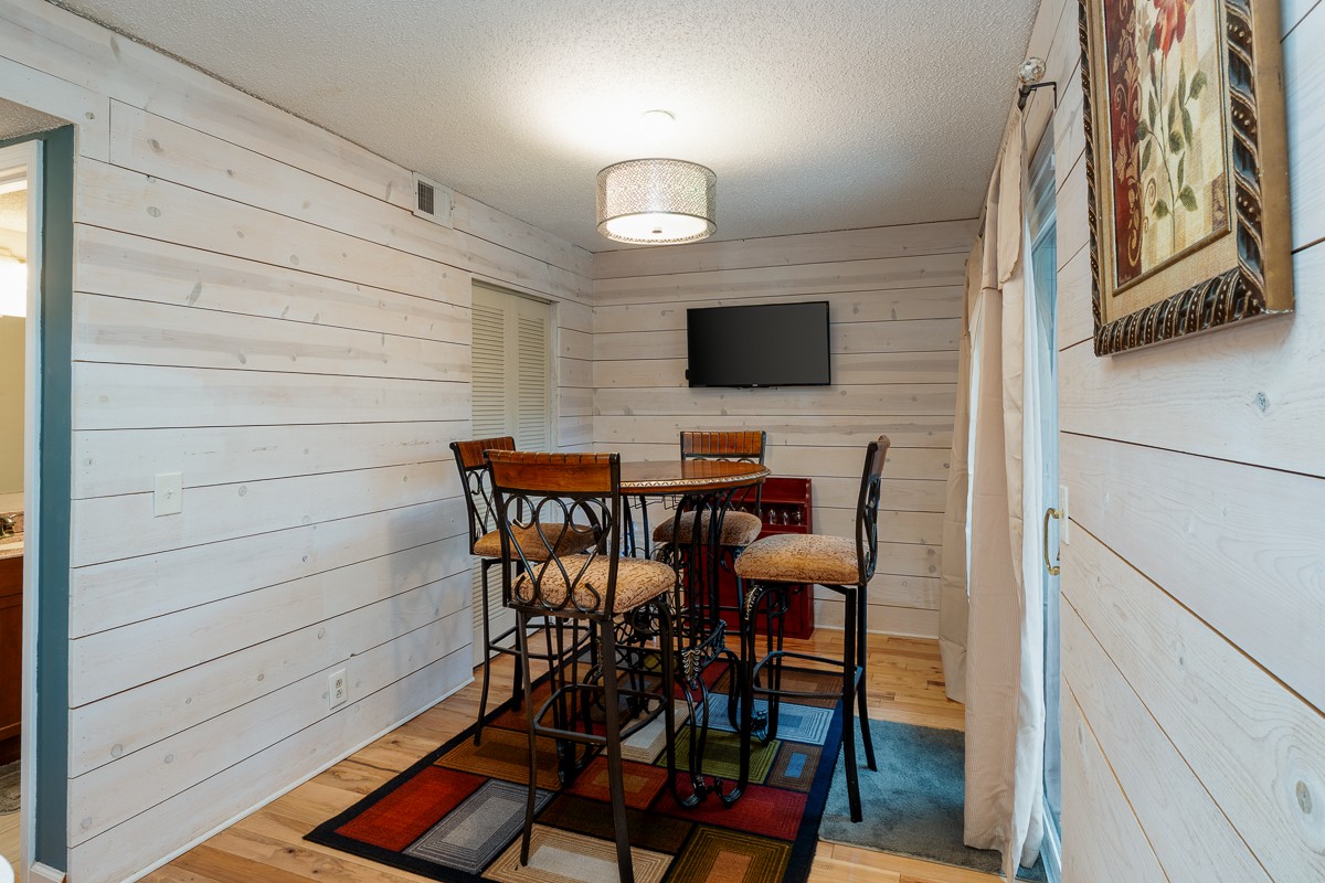 4000 Anderson Road, Unit 82 Nashville, TN 37217 - Photo 14 of 30 a view of a dining room with furniture and wooden floor