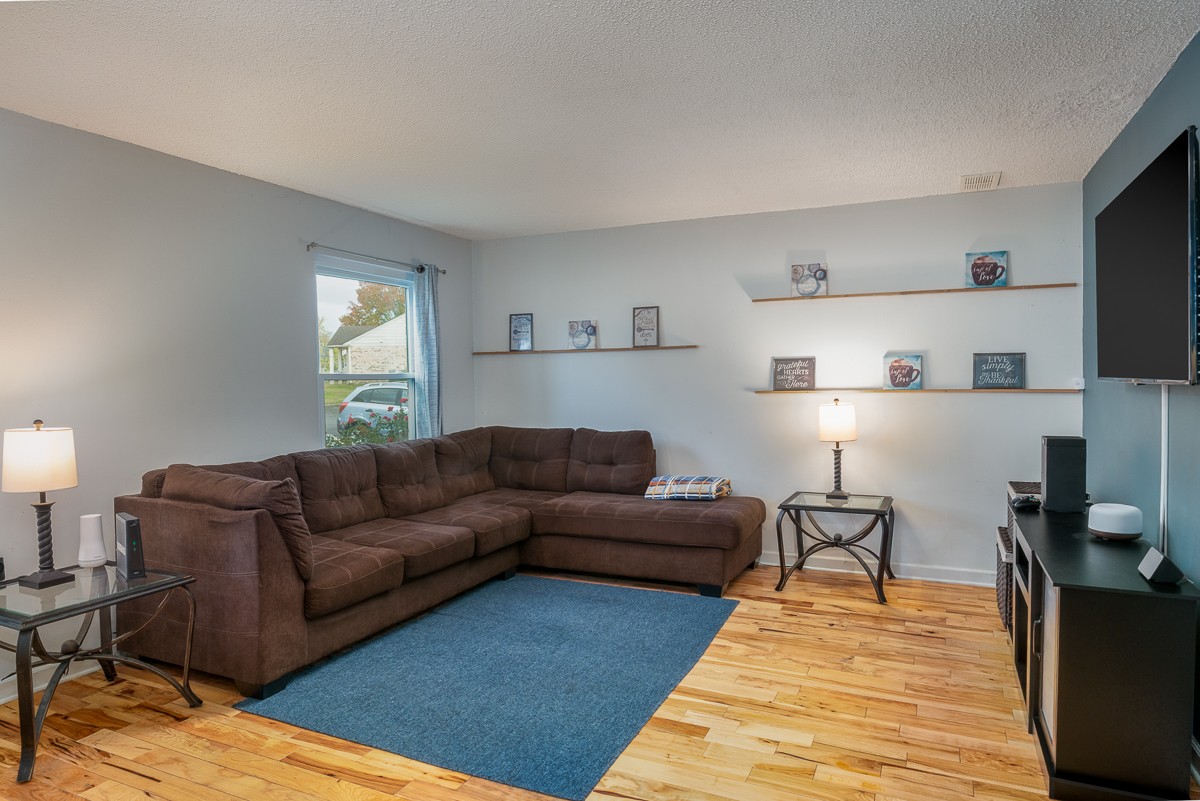 4000 Anderson Road, Unit 82 Nashville, TN 37217 - Photo 2 of 30 a living room with furniture and a couch