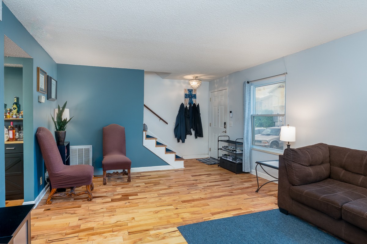 4000 Anderson Road, Unit 82 Nashville, TN 37217 - Photo 4 of 30 a living room with furniture and wooden floor