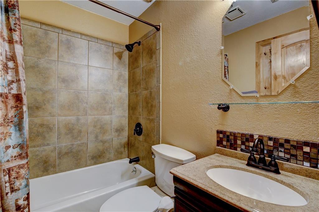 520 Bills Ranch Road, Unit 173 Frisco, CO 80443 - Photo 13 of 24 a bathroom with a sink toilet a mirror and shower