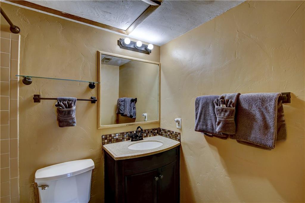 520 Bills Ranch Road, Unit 173 Frisco, CO 80443 - Photo 20 of 24 a bathroom with a granite countertop sink and a mirror