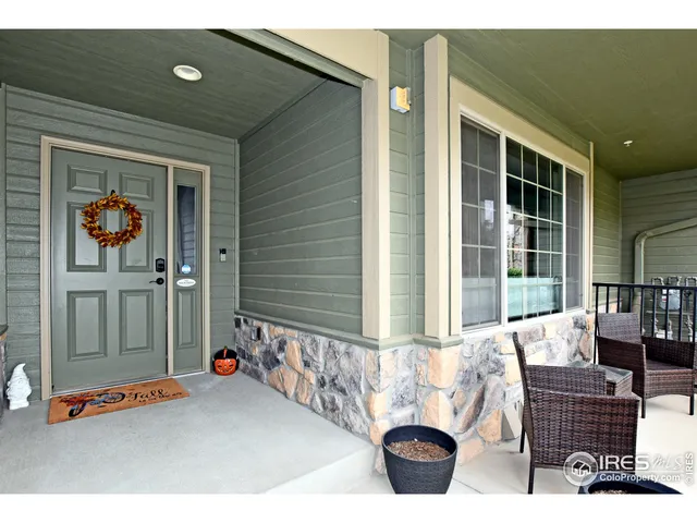 a outdoor living space with patio furniture and potted plants