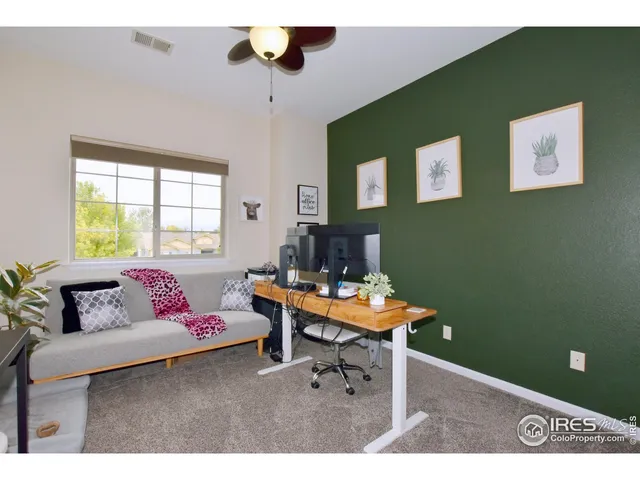 a outdoor living space with furniture and a fireplace