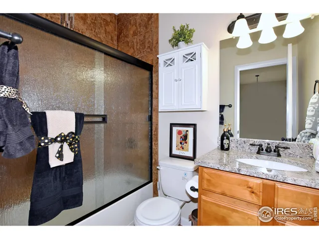 a roof deck with table and chairs