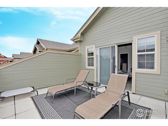 a bedroom with a bed and a table