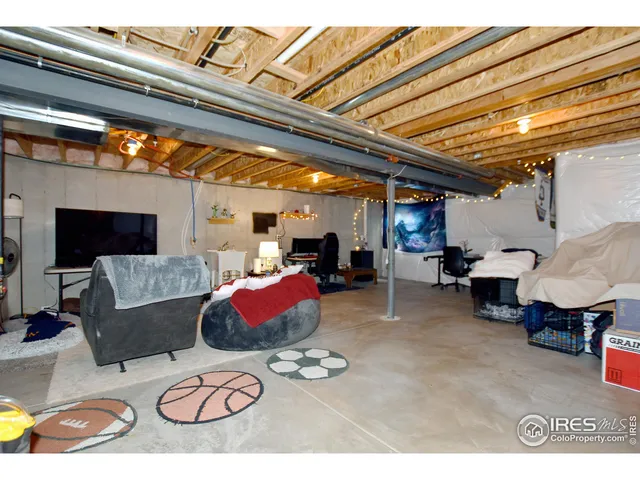 a view of parking garage with cars parked