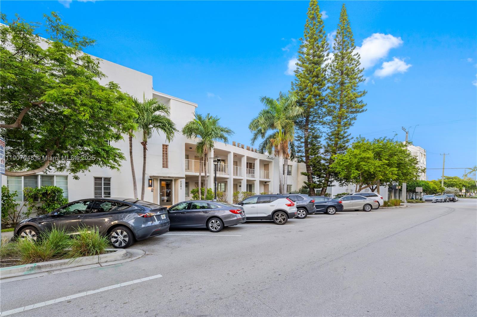 1241 14th Street, Unit 11 Miami Beach, FL 33139 - Photo 2 of 20 a view of a cars park in front of a building