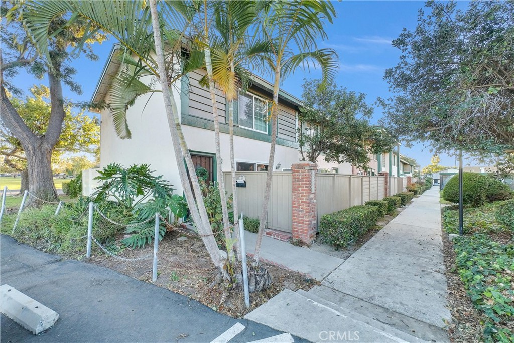 8083 Kerr Green Buena Park, CA 90621 - Photo 2 of 40 a front view of a house with a yard and potted plants