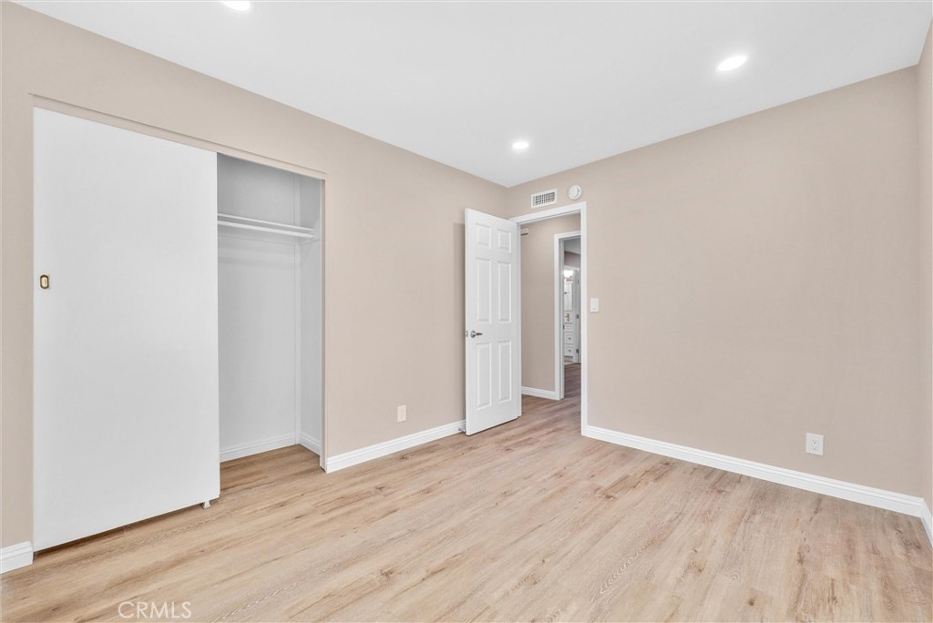 8083 Kerr Green Buena Park, CA 90621 - Photo 21 of 40 a view of an empty room with wooden floor