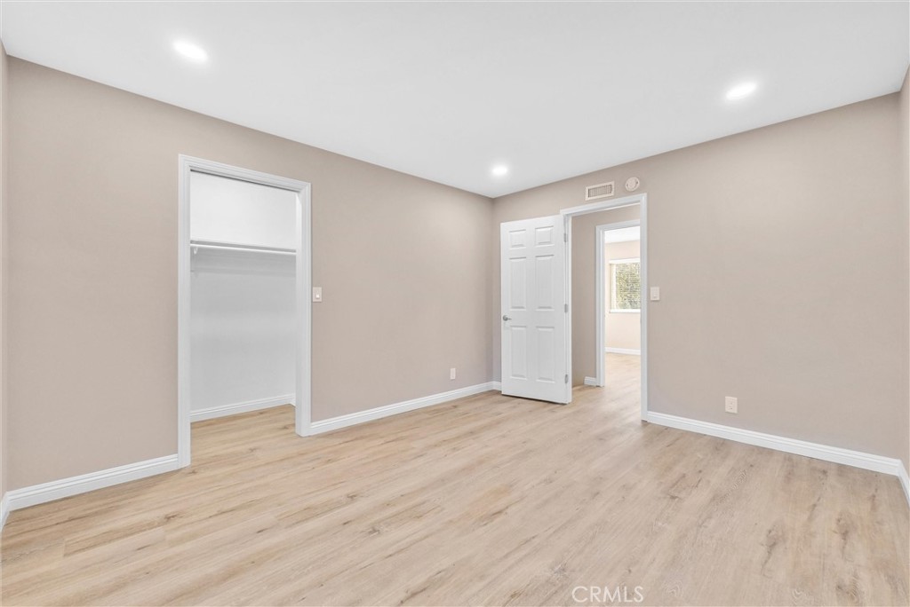 8083 Kerr Green Buena Park, CA 90621 - Photo 23 of 40 a view of an empty room with wooden floor