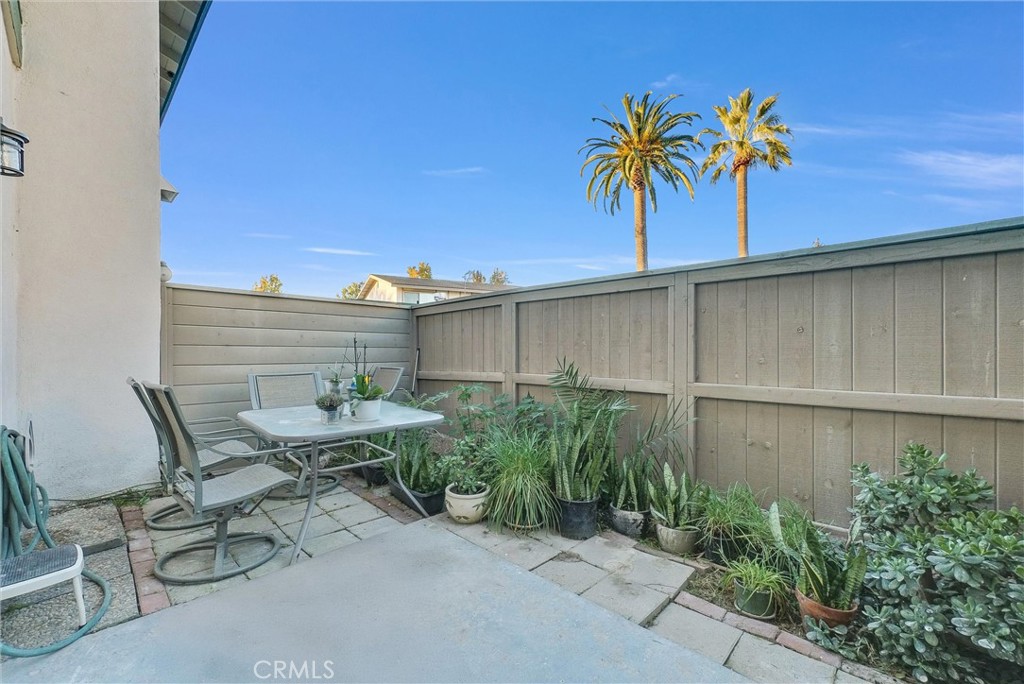 8083 Kerr Green Buena Park, CA 90621 - Photo 29 of 40 a view of a backyard with a chair and potted plants