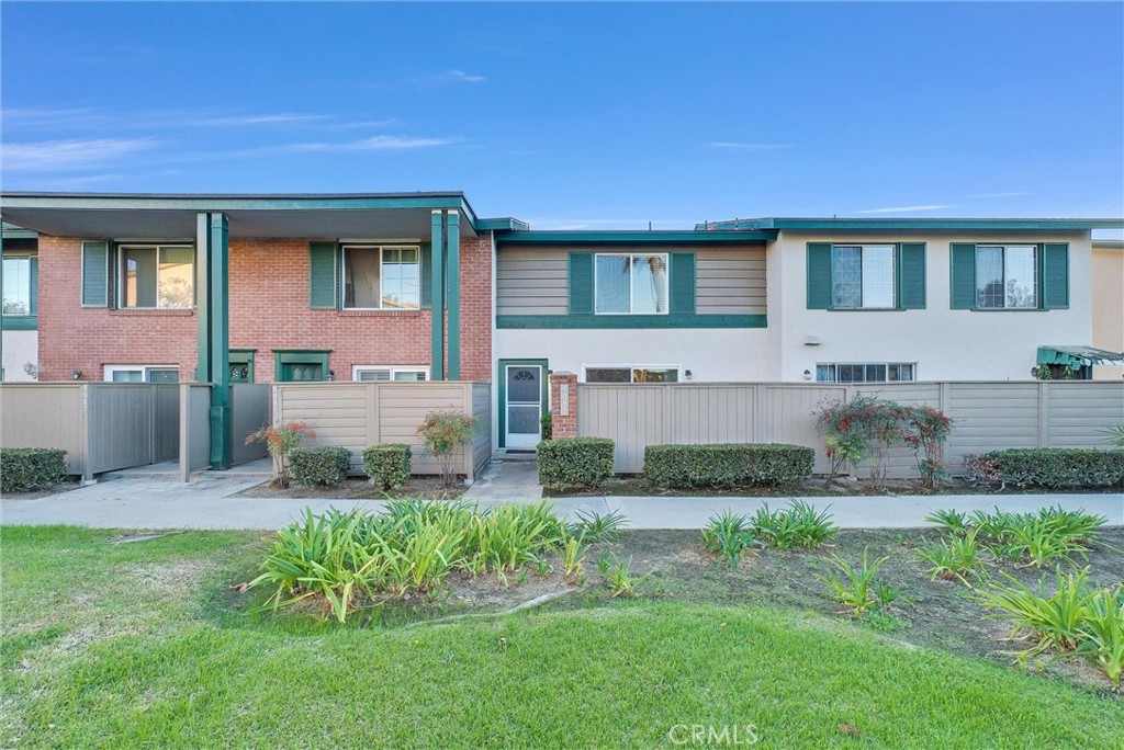 8083 Kerr Green Buena Park, CA 90621 - Photo 3 of 40 a front view of a house with a yard