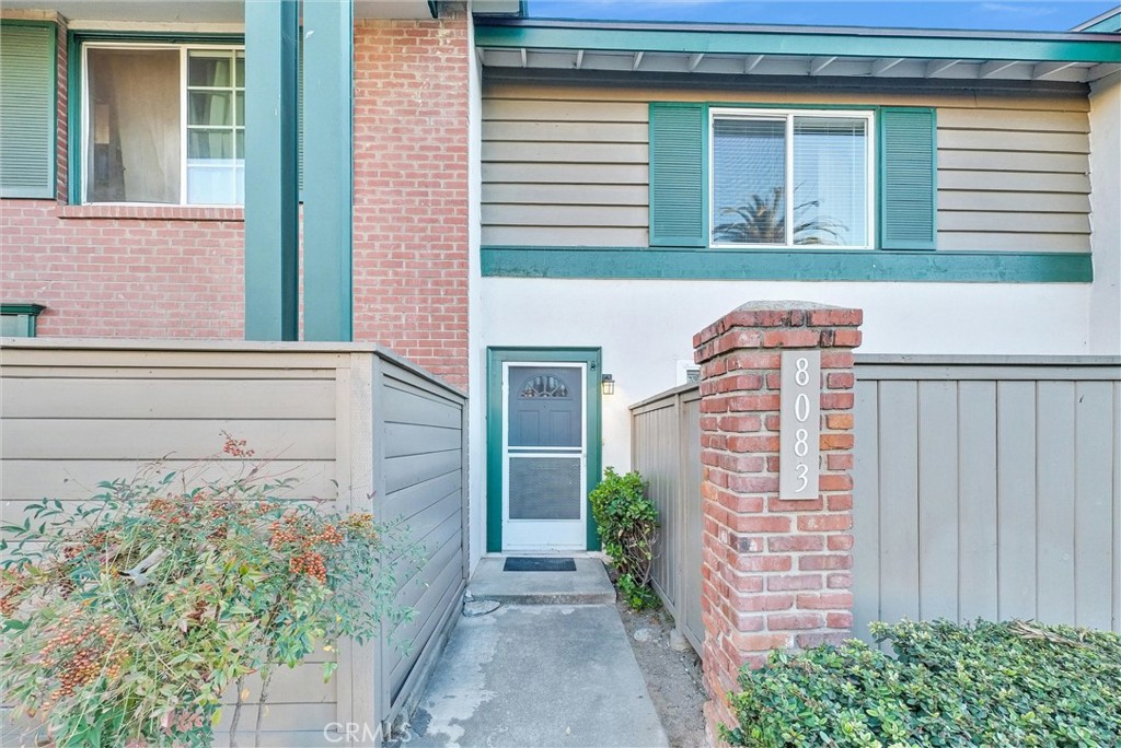 8083 Kerr Green Buena Park, CA 90621 - Photo 4 of 40 a pathway of a house with potted plants