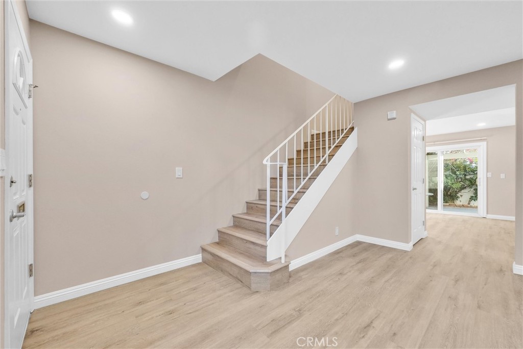 8083 Kerr Green Buena Park, CA 90621 - Photo 5 of 40 a view of entryway and hall with wooden floor