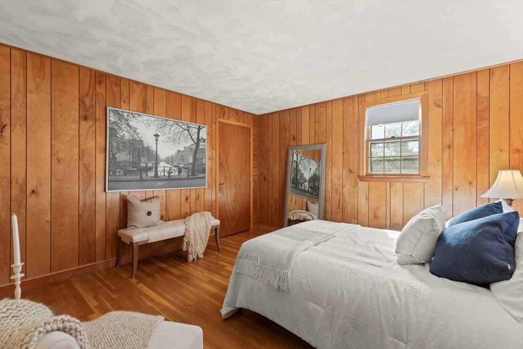 7 Debra Lane Framingham, MA 01701 - Photo 18 of 27 a bedroom with a bed and a window