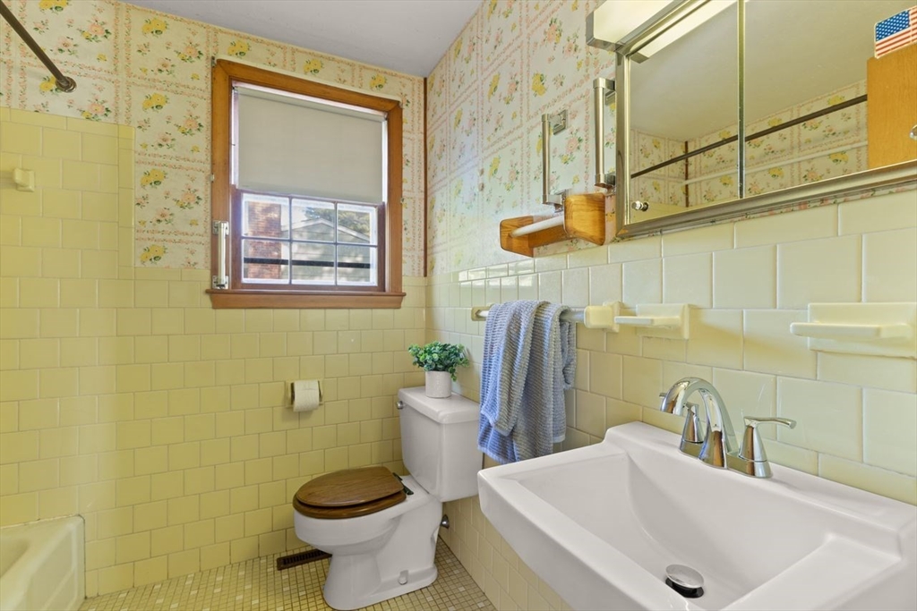 7 Debra Lane Framingham, MA 01701 - Photo 22 of 27 a bathroom with a sink and a toilet