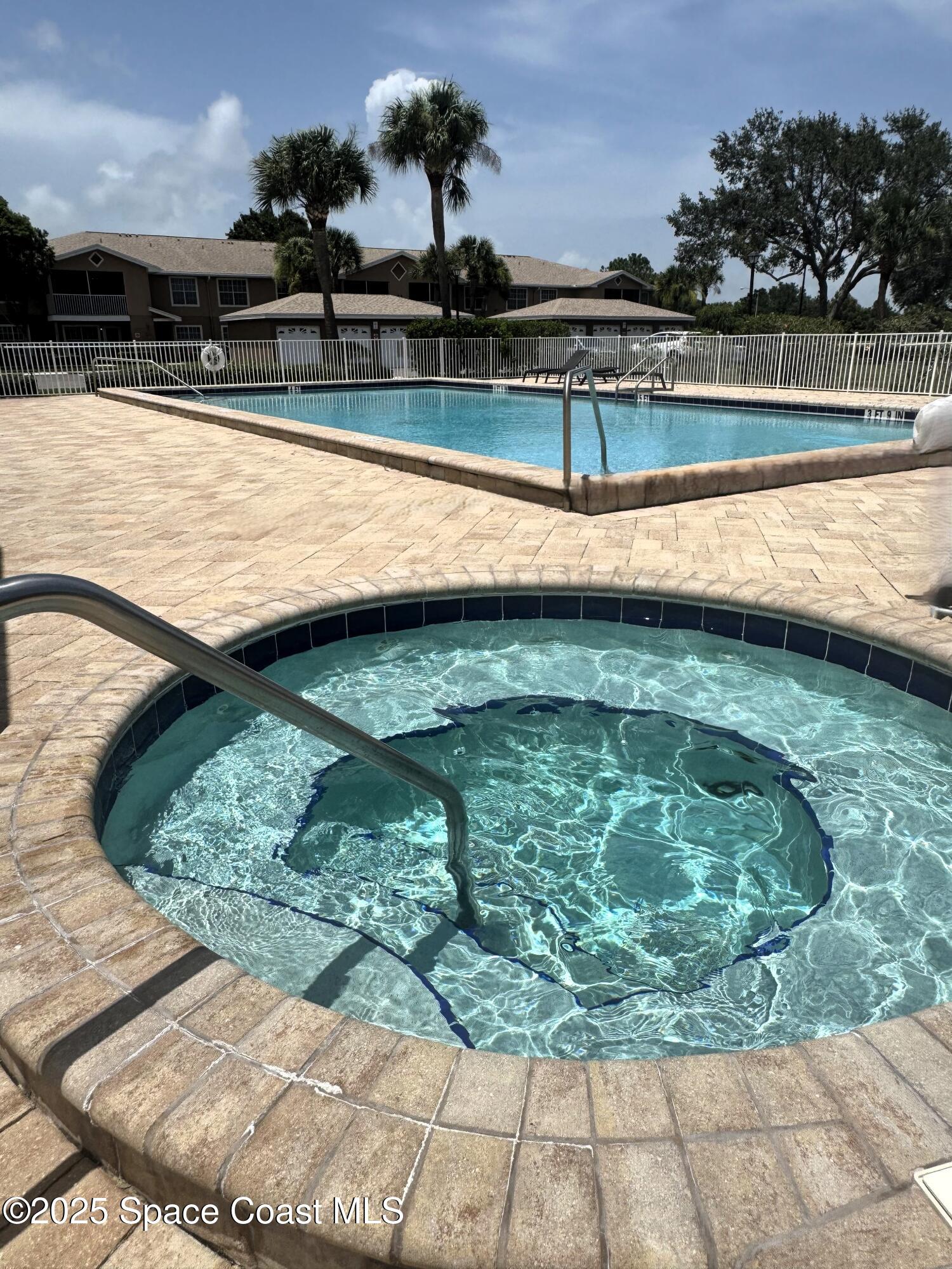 1861 Long Iron Drive, Unit 1121 Rockledge, FL 32955 - Photo 2 of 35 a view of a swimming pool with a lake