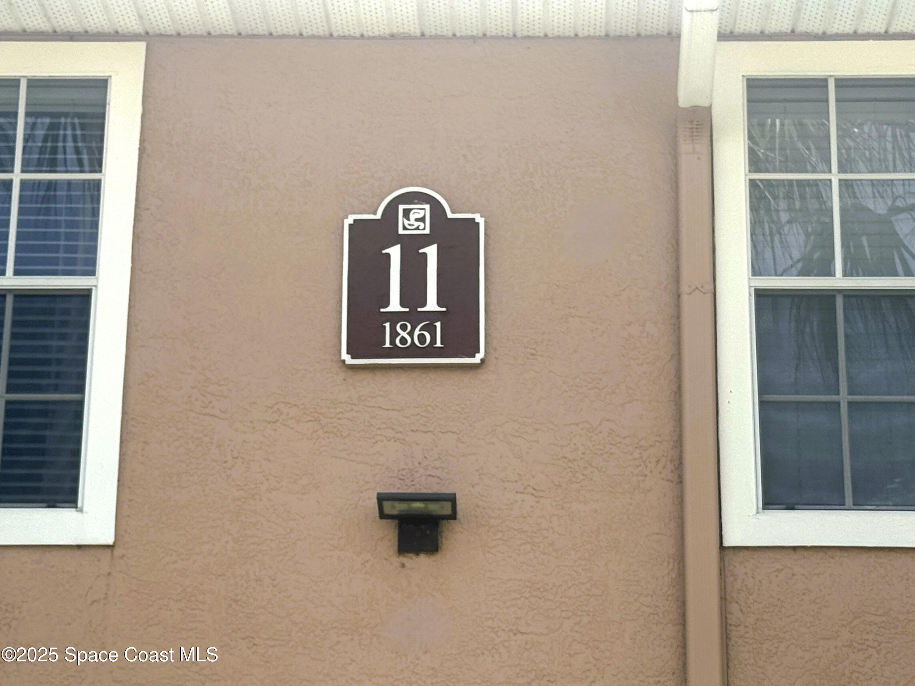 1861 Long Iron Drive, Unit 1121 Rockledge, FL 32955 - Photo 22 of 35 a wall with a potted plant on it